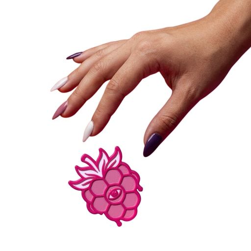 An open hand reaching toward a berry.